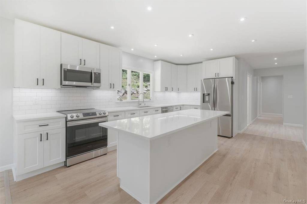 Welcome to this stunning 5 bedroom, 3 full bathroom raised ranch home, where comfort and elegance meet.