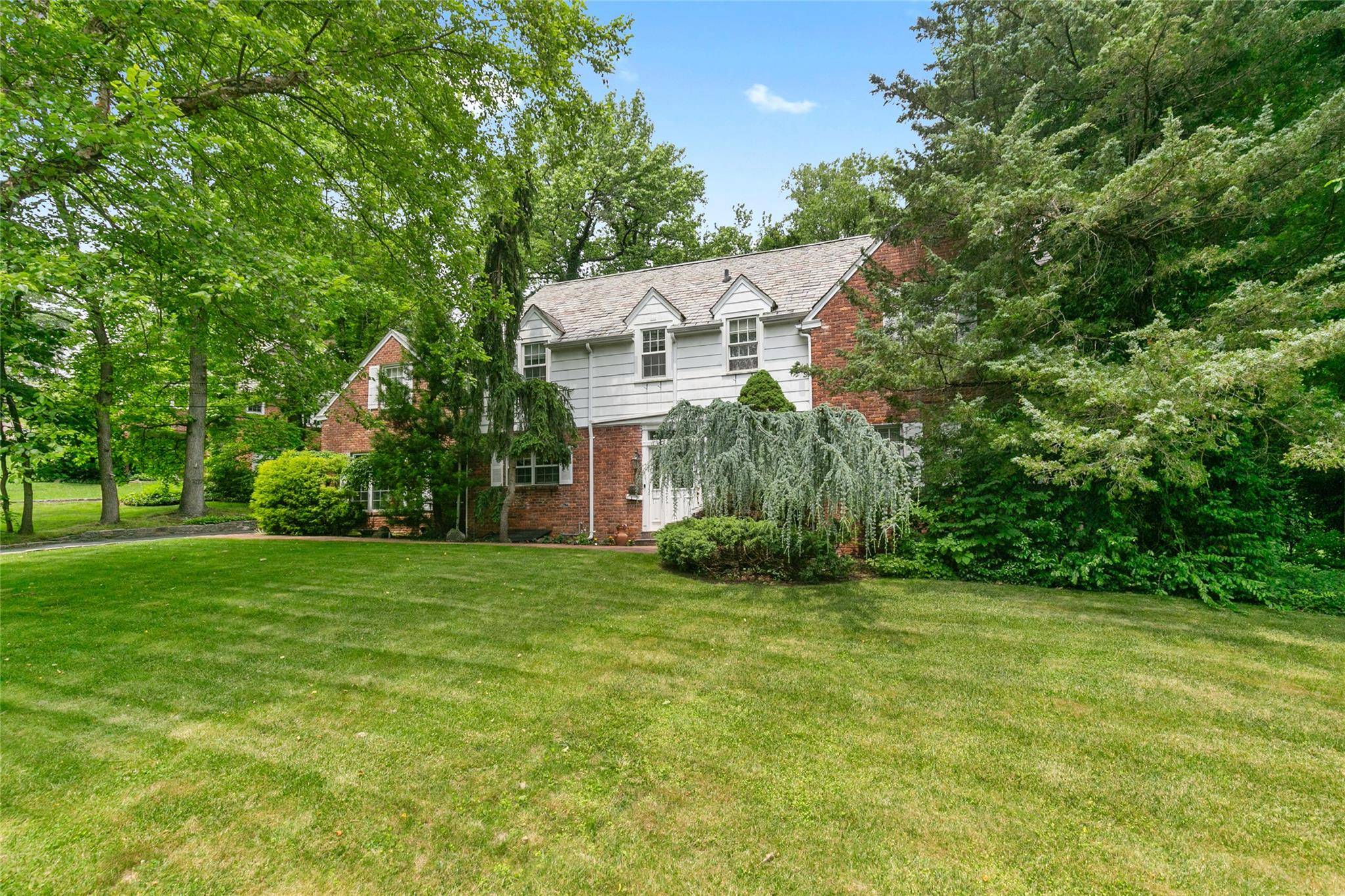 Stately BRICK C H Colonial Blending Timeless Charm With Modern Comfort amp ; Spacious Interiors.