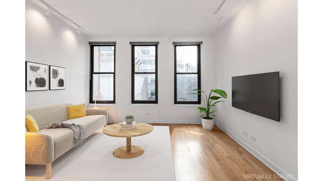 Residence 8B is a loft like one bedroom condominium with both South and Eastern exposures in landmarked 56 Pine Street.
