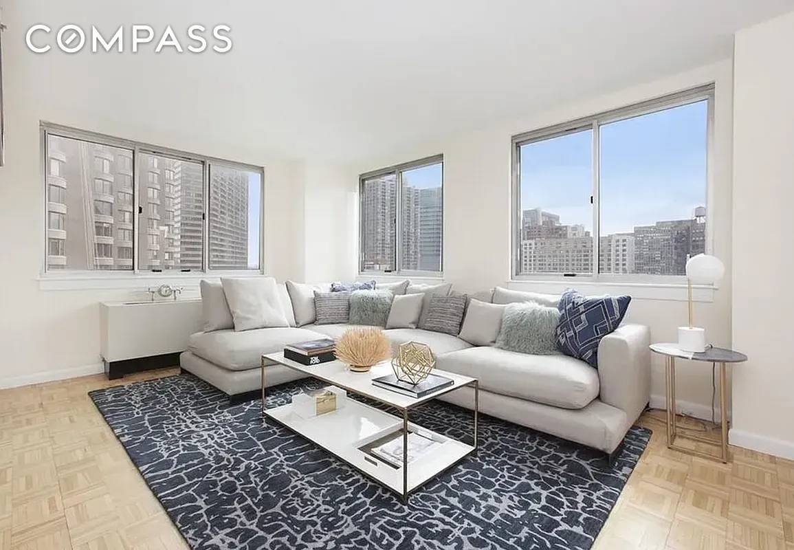 Spacious Sun bathed Two Bedroom Convertible Three bed condominium with washer dryer.