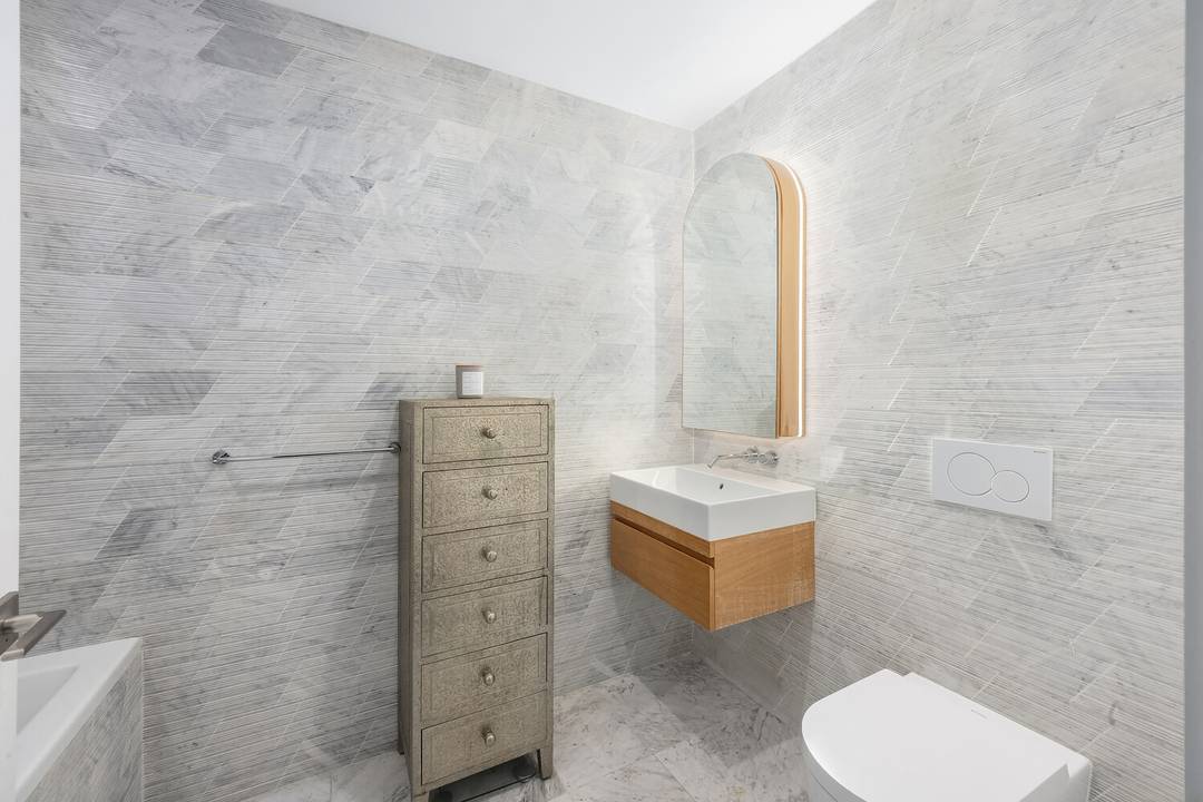 This one bedroom residence exudes a sense of home with its spacious layout and bright custom built home office, perfect for remote work or personal projects.