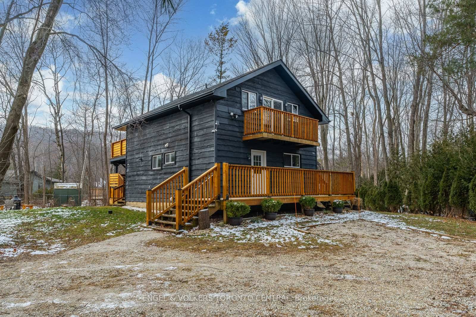 Escape to this authentic Swiss chalet, perfectly nestled among towering trees and just minutes from Blue Mountain Village.