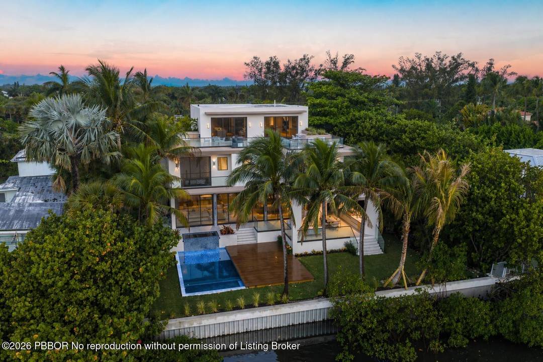 Welcome to 5 Barefoot Lane a newly constructed, gated waterfront estate on Hypoluxo Island, where privacy is not just a feature, but the ultimate luxury.