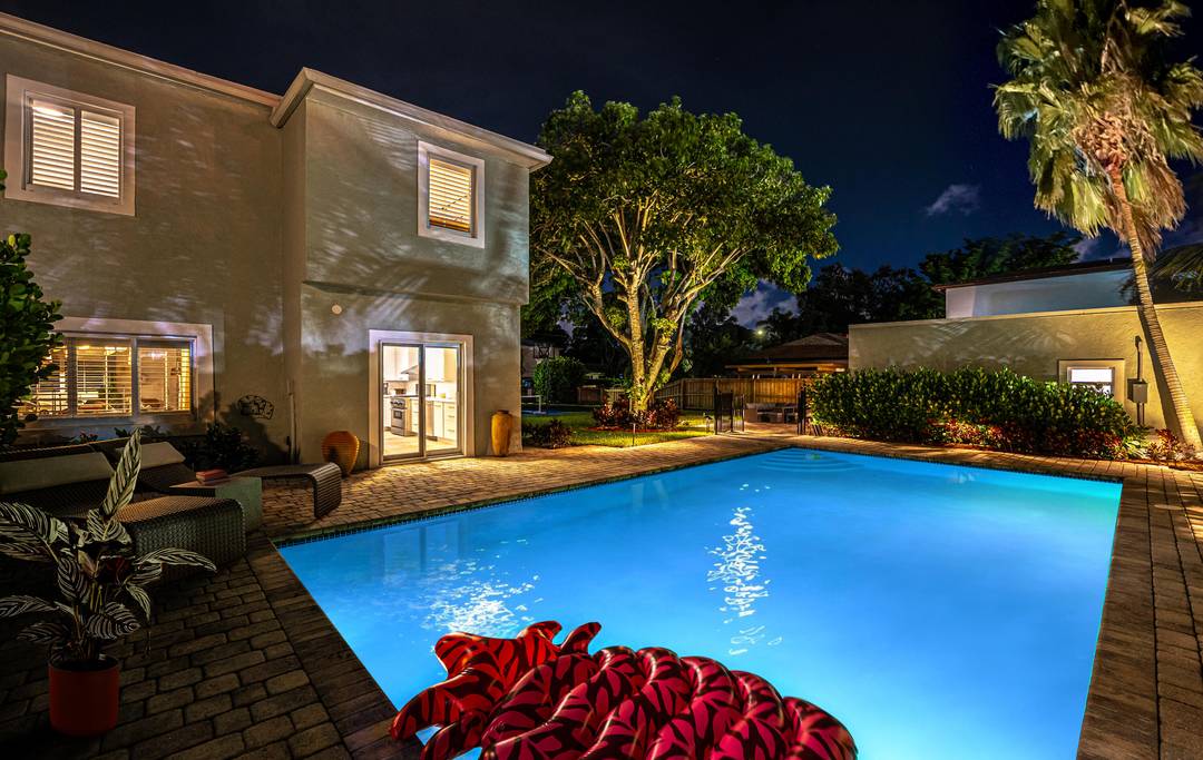 Exceptional 8 bedroom, 5 bath compound on a rare double lot featuring a resort style pool and private pickleball court.