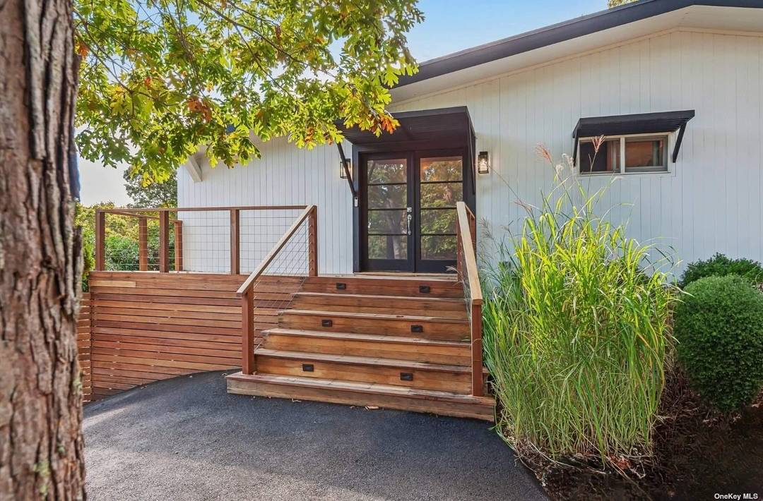 Immerse yourself in the ultimate resort like living at 69 Three Mile Harbor Drive, offering convenient access to East Hampton's Sammy's Beach and a quick drive to elevated town living.