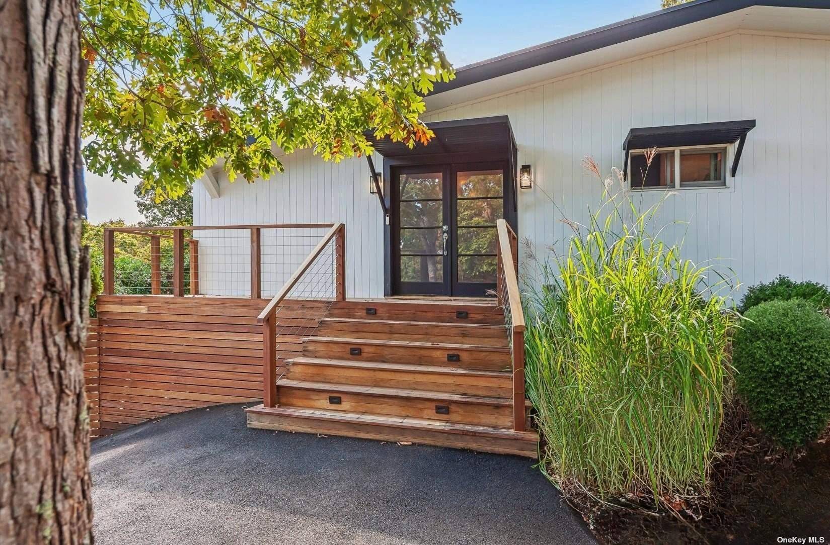 Immerse yourself in the ultimate resort like living at 69 Three Mile Harbor Drive, offering convenient access to East Hampton's Sammy's Beach and a quick drive to elevated town living.