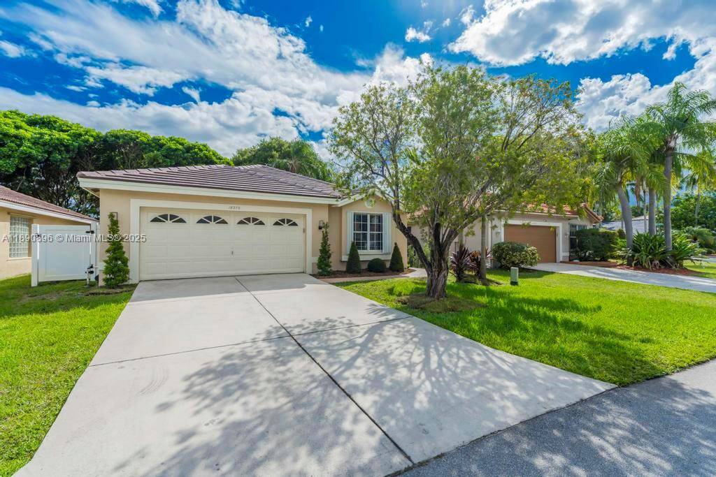 Beautifully updated 3 bedroom, 2 bath home with a 2 car garage and a brand new roof 2025, accordion shutters throughout in the sought after community of Silver Lakes.