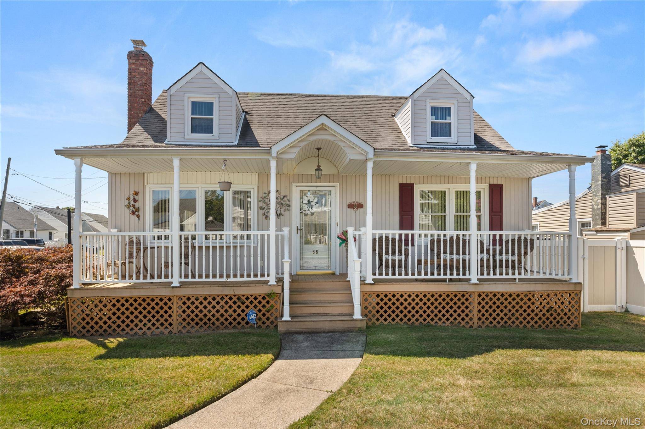 Beautifully maintained expanded cape situated on a generous 60x100 corner lot in The American Venice section of Lindenhurst.