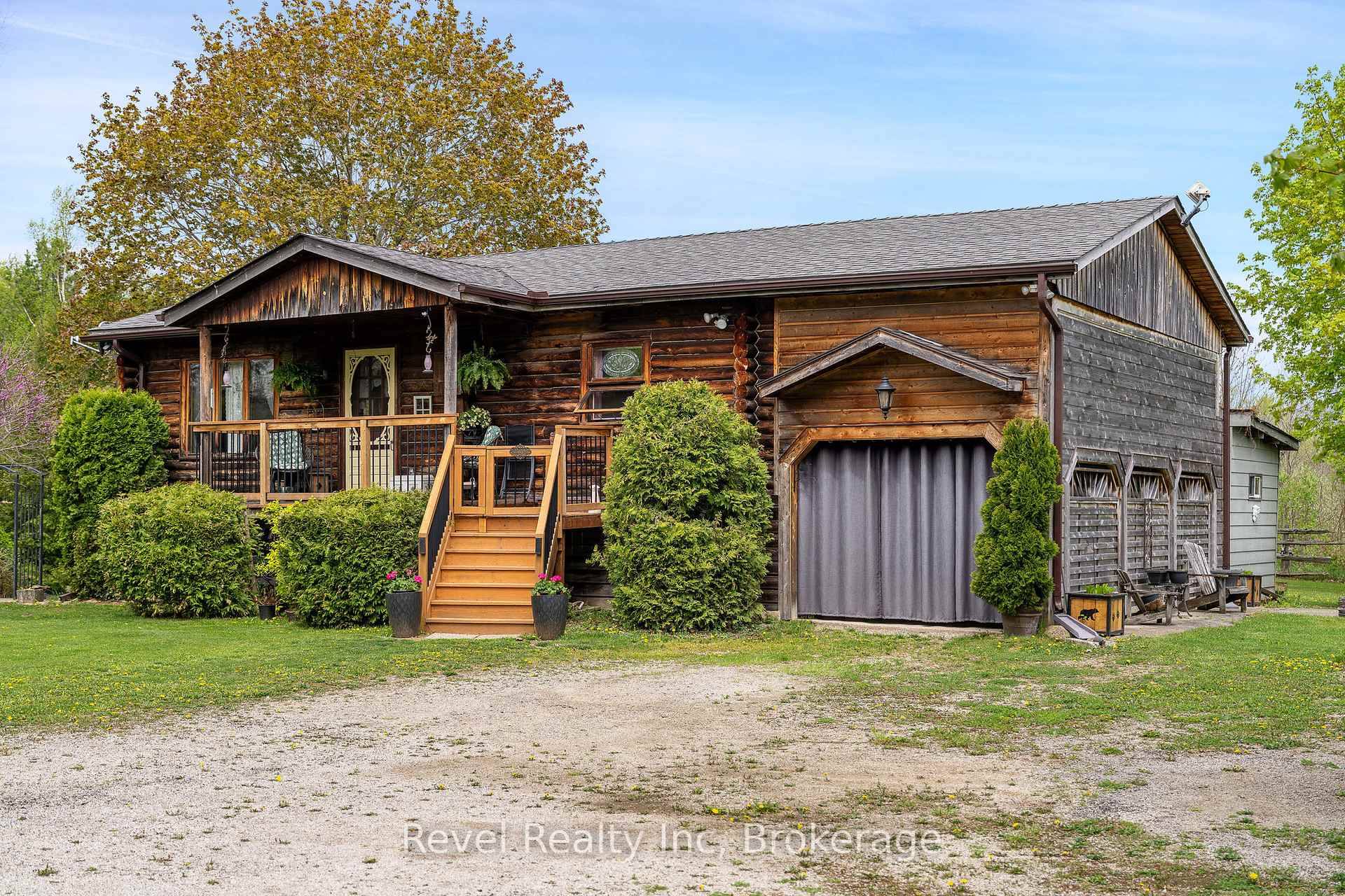 Welcome to 383349 Dawson Road in beautiful Georgian Bluffs where privacy, nature, and charm come together in this stunning custom built log home.