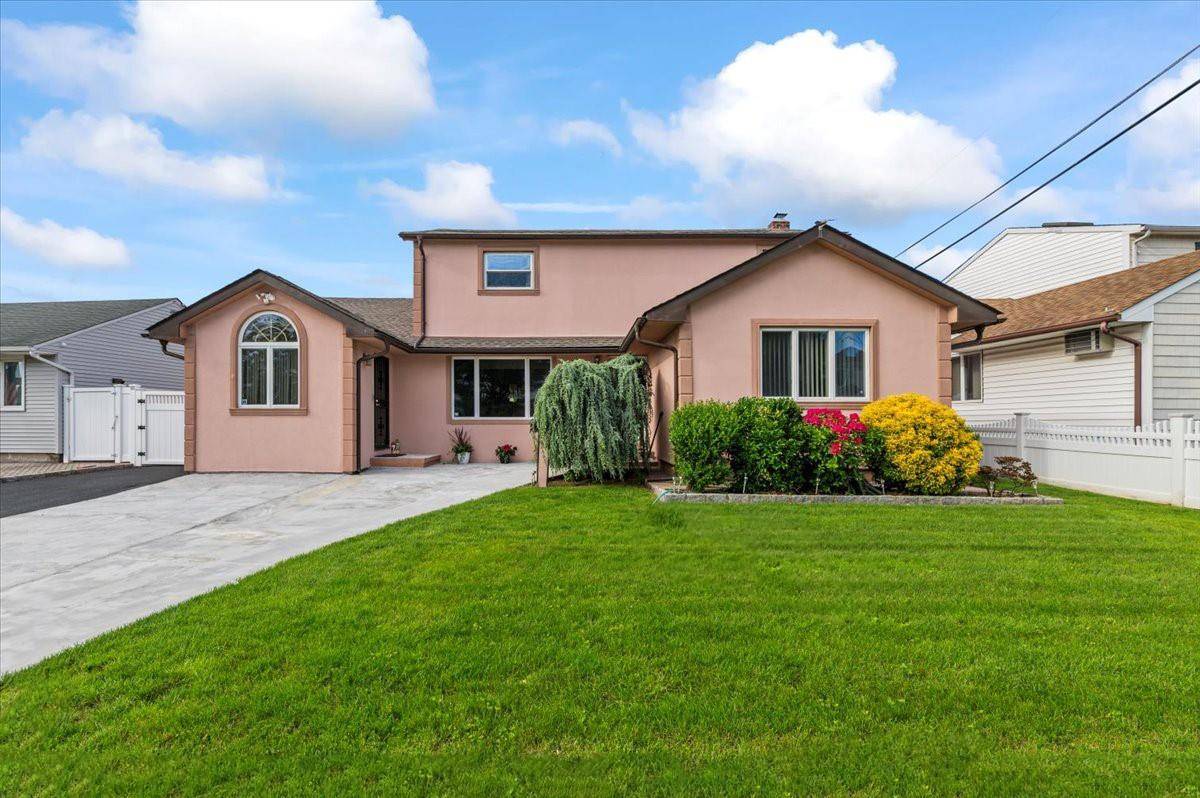 Welcome to this spacious 5 bedroom, 3 bathroom expanded Colonial in Bethpage.