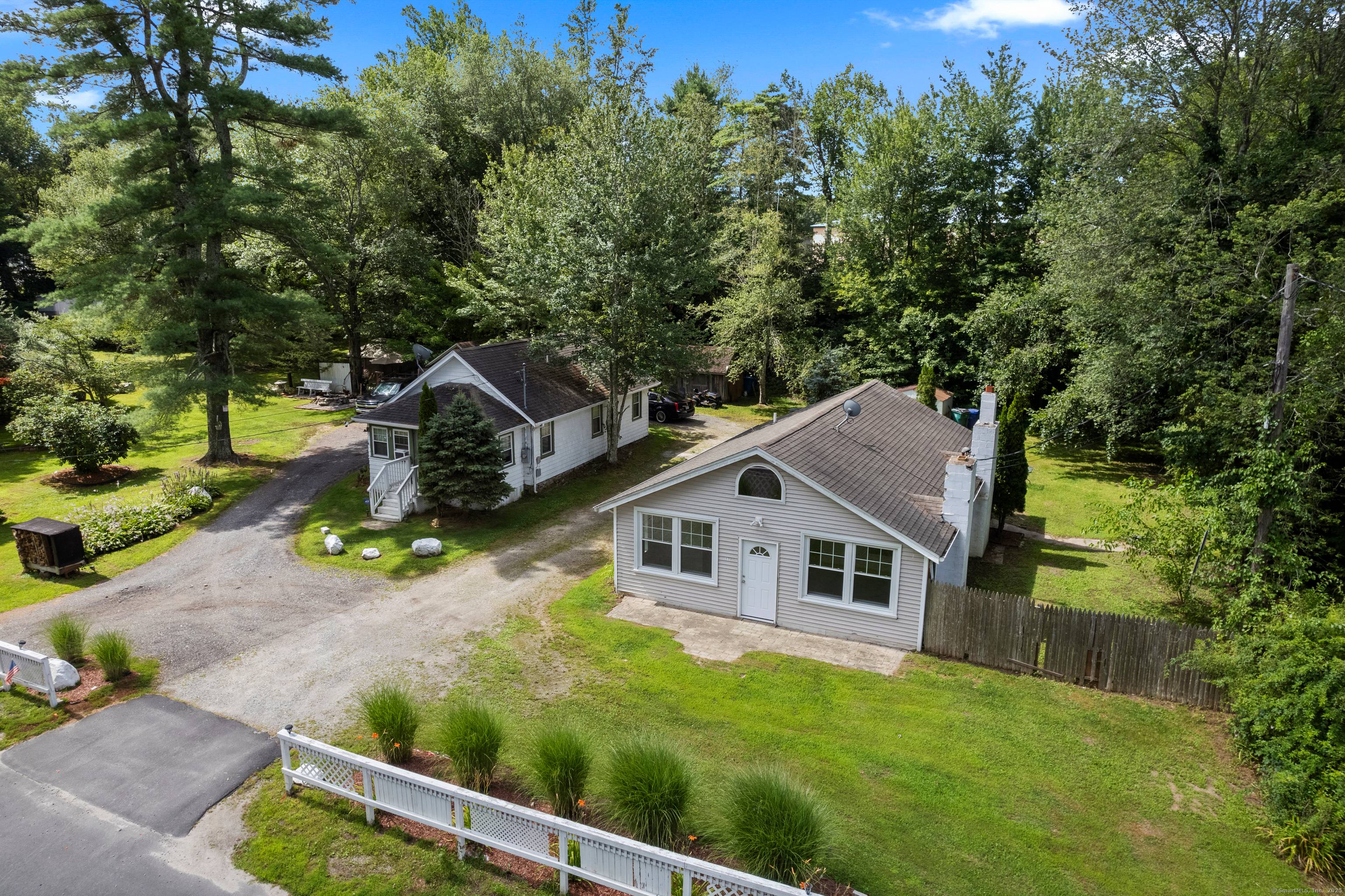 This acre and a half parcel consists of two small ranch style dwellings, multiple sheds, and a 2012 constructed barn.