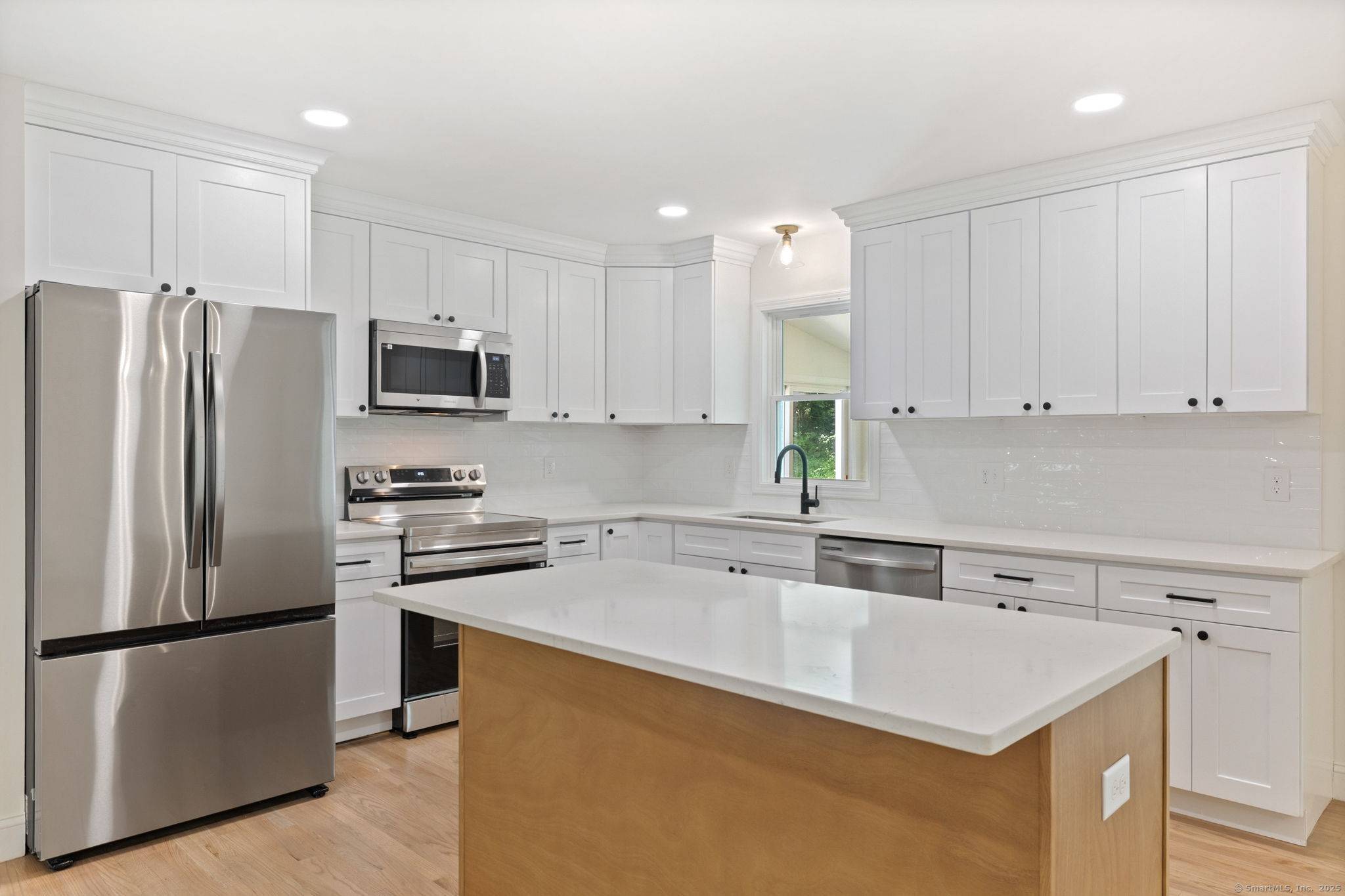 Welcome to this beautifully updated raised ranch nestled in the heart of Sandy Hook, CT.