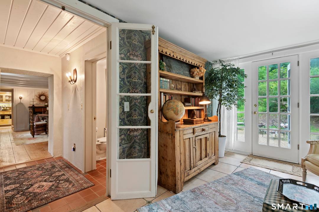A rare and captivating offering, this enchanting storybook residence has been beautifully reimagined to deliver a seamless blend of historic charm and refined design.