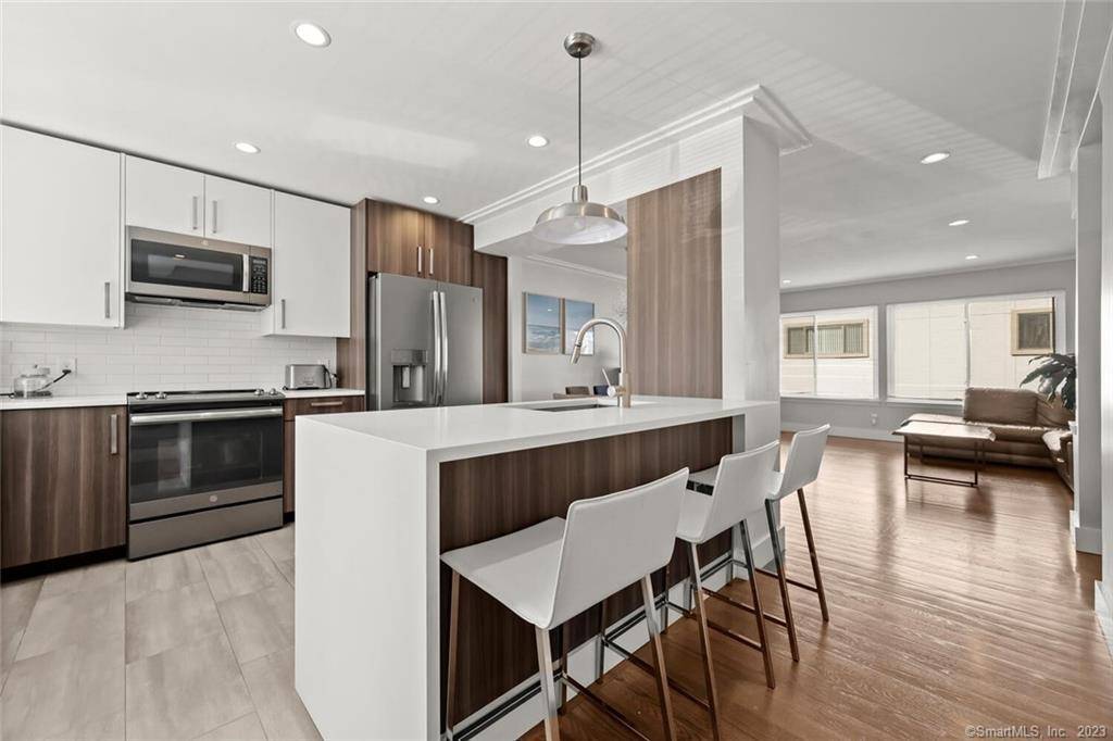 One of a kind ! The stunning, bright and sun filled 3 level end unit, completely renovated with modern accents.