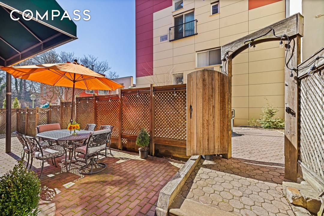 An Outdoor Oasis in Ridgewood Welcome to Unit J1B at The Glenridge Mews Condominium, a rare garden level home offering exceptional indoor outdoor living.