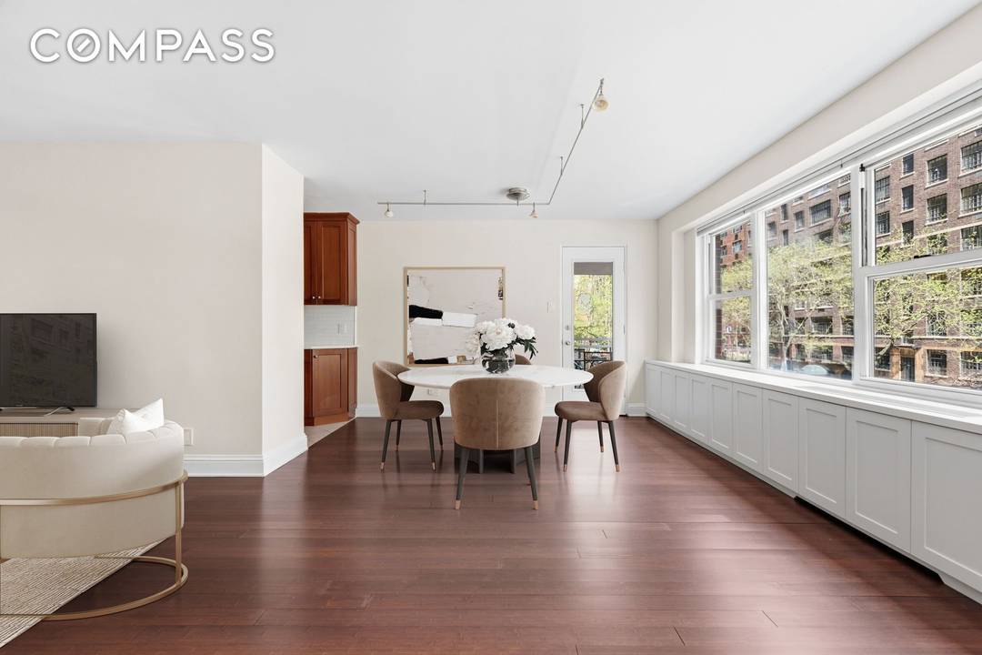 Renovated Junior 4 with a private balcony and exceptionally low maintenance including all utilities at 360 East 72nd Street, a premier Upper East Side address.