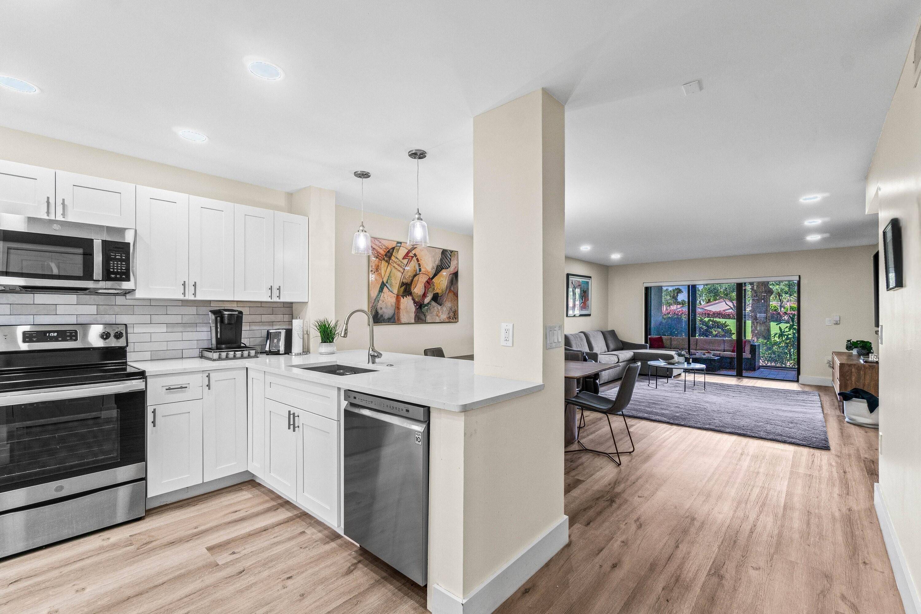 Lovely, fully renovated 1st floor 2BR 2BA condo with sweeping views of the golf course.
