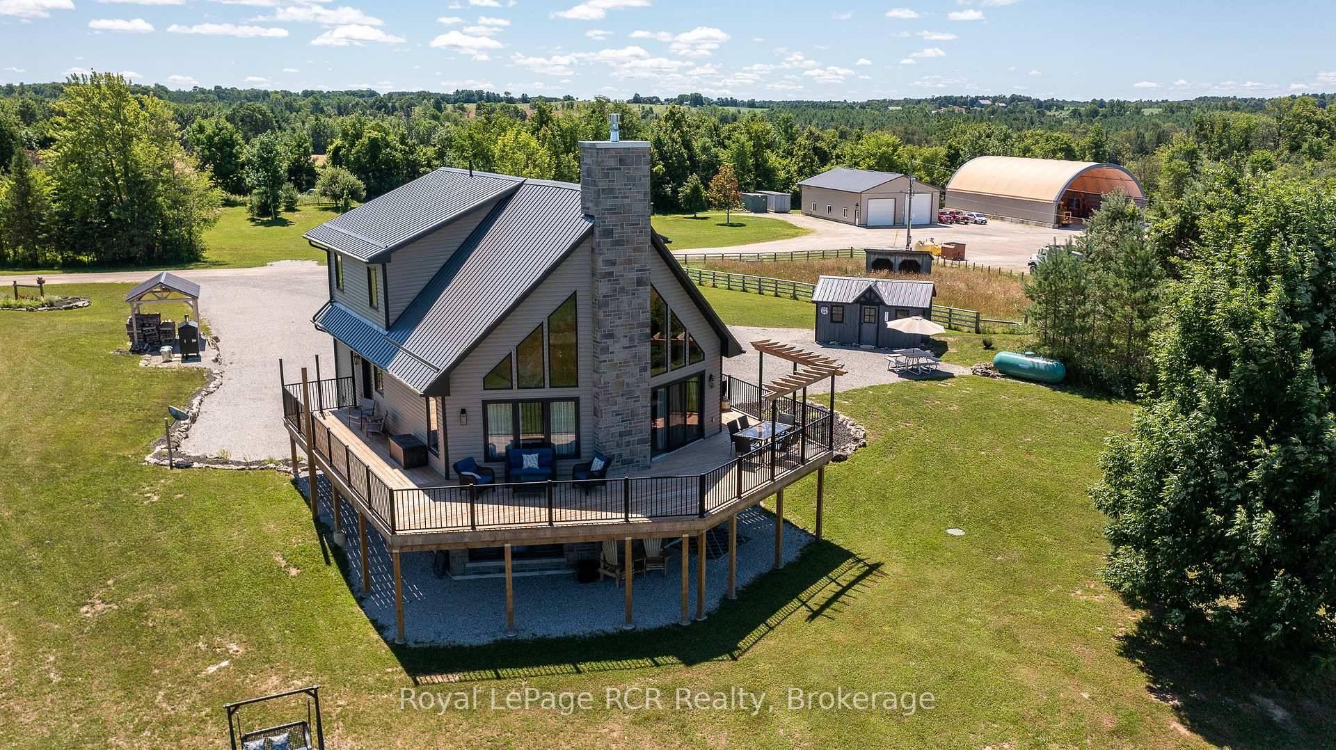 27 acre farm with a shop, storage building and home.