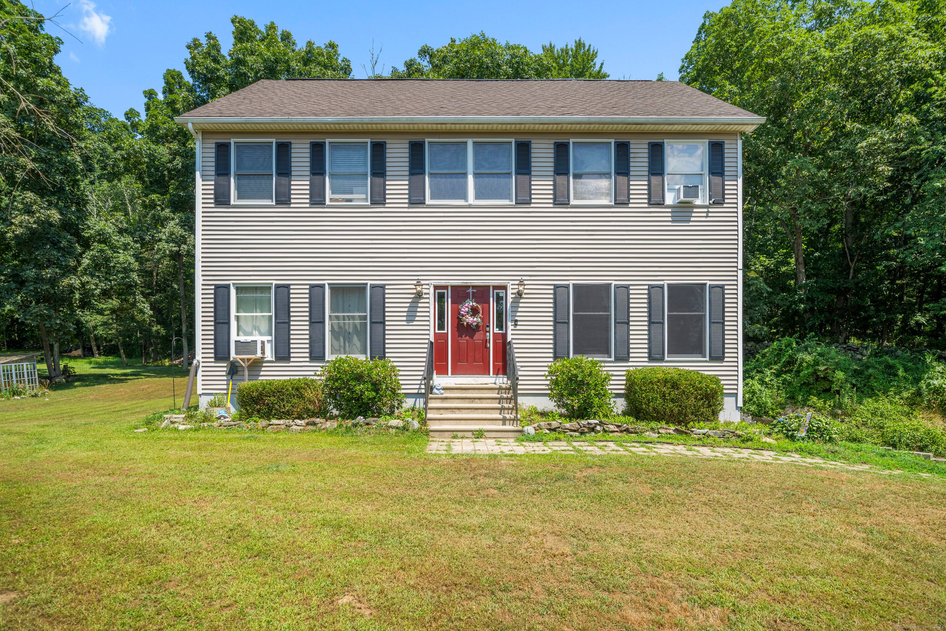 Welcome to 8 Huntington Drive, a beautifully maintained Colonial nestled in the trees in the desirable Huntington Estates neighborhood.