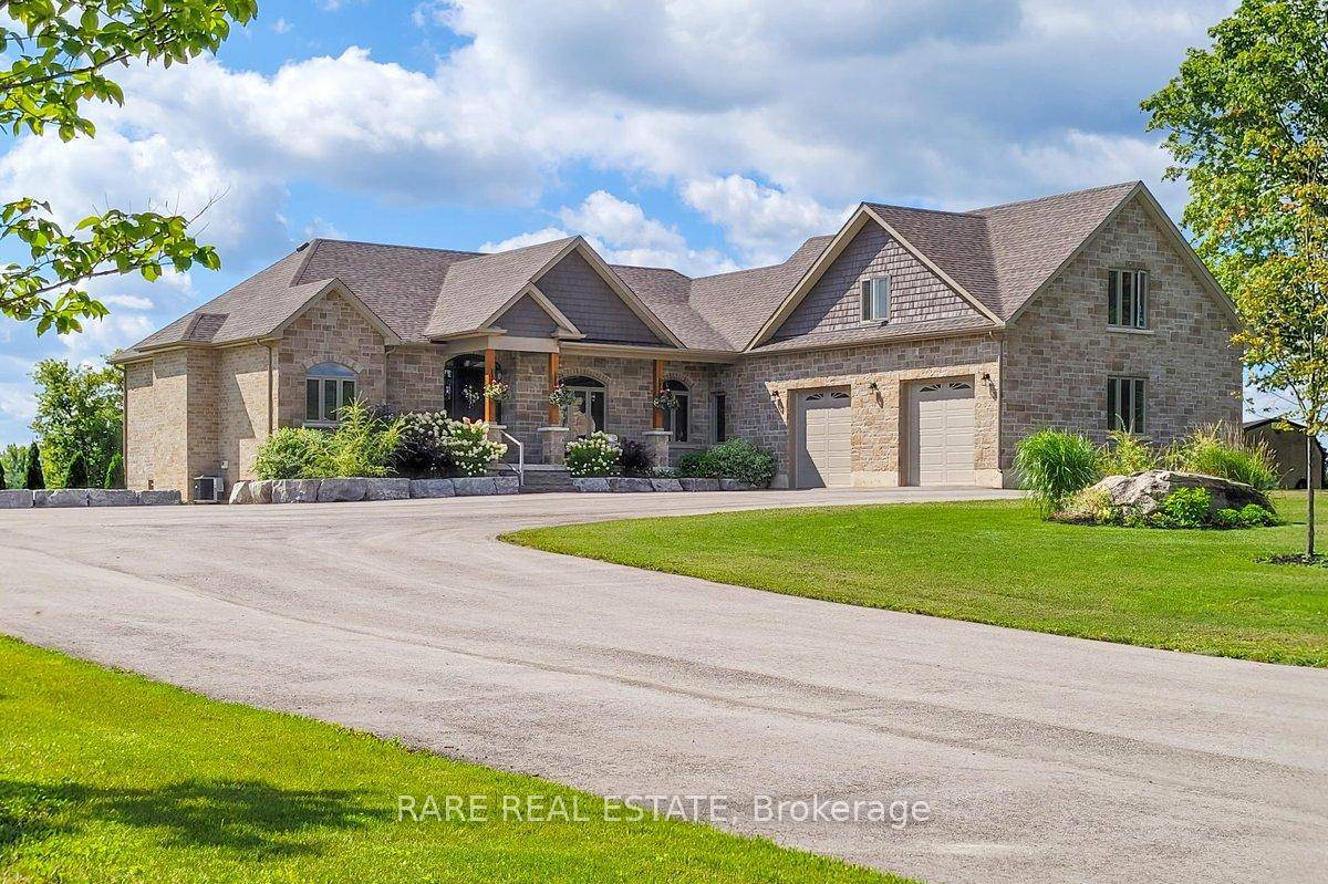 Exceptional custom built bungalow featuring a walk out basement and a fully equipped detached workshop, nestled on a beautifully maintained 19 acre property.