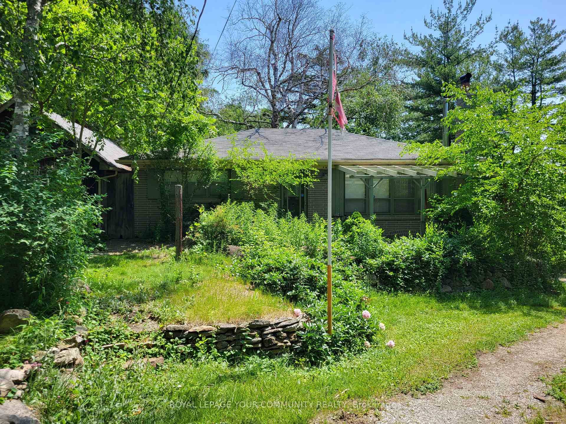A conventional 1950's two bedroom bungalow situated on approximately 3 4s of an acre of mature amp ; picturesque prime land, minutes from downtown Richmond Hill.