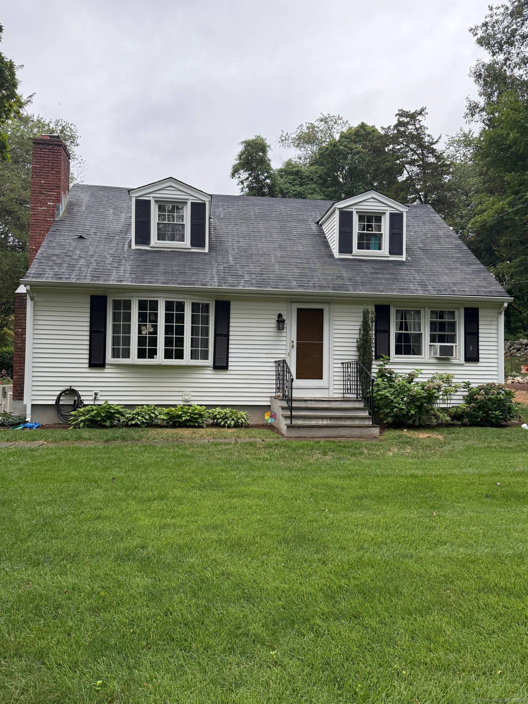 Immaculate 4 bedroom Cape Cod conveniently located to Merritt Parkway Route 15.