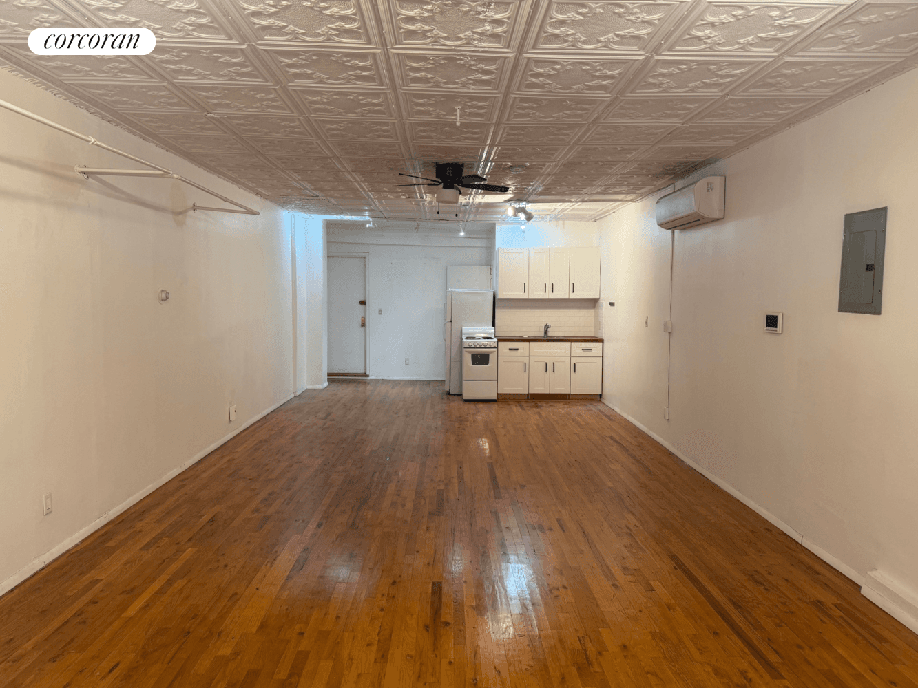 Live work lifestyle Massive Studio Loft with high ceilings and hardwood flooring Updated kitchen, Oversized Windows, Original details Shared Roof Deck, with city views