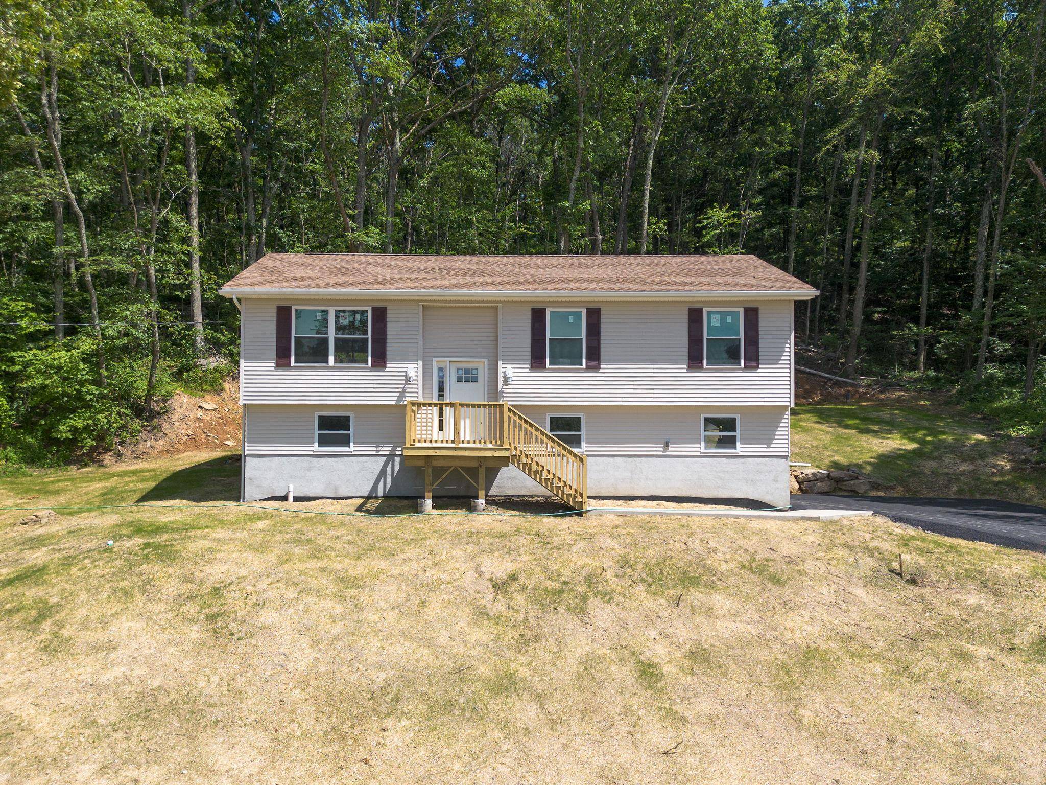Discover this brand new, light filled Raised Ranch ideally situated on 2.