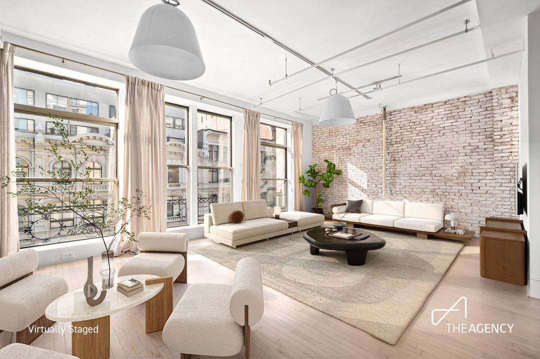 Residence 6F at 652 Broadway is a striking cast iron landmarked historic loft located at the crossroads of Broadway and Bond Street in NoHo.