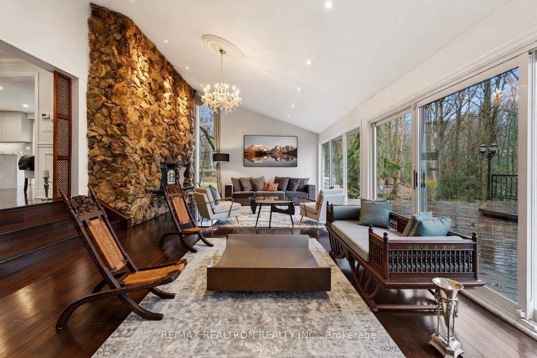 Tucked away within 4. 12 acres of serene, forested landscape, this extraordinary custom residence offers an unparalleled blend of seclusion, sophistication, and contemporary living just moments from the city.