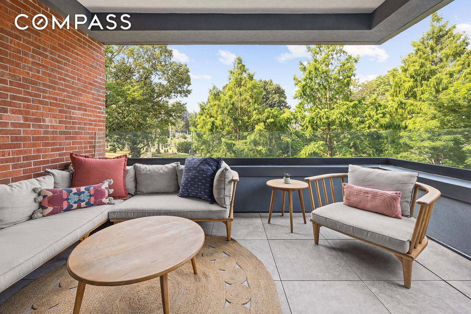 Expansive, designer curated three bedroom condo with a large private balcony directly overlooking the park like oasis of Greenwood Cemetery.