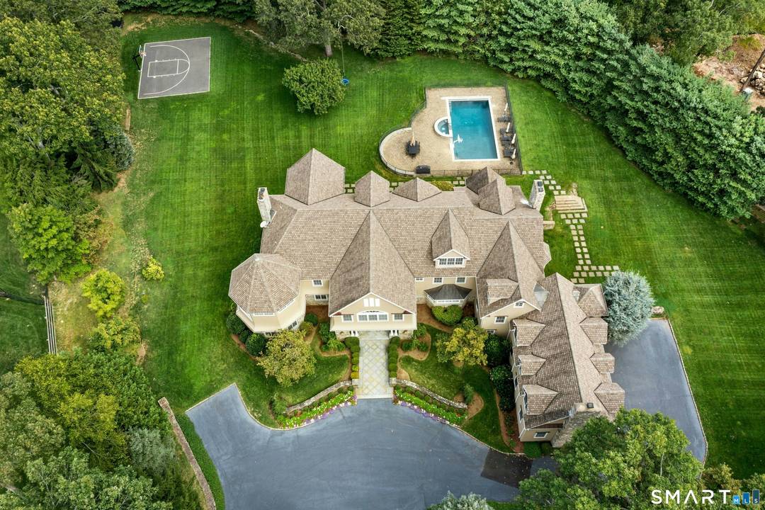 In the heart of a neighborhood known for fine estates and just moments from the campus of award winning schools, this distinguished 2.