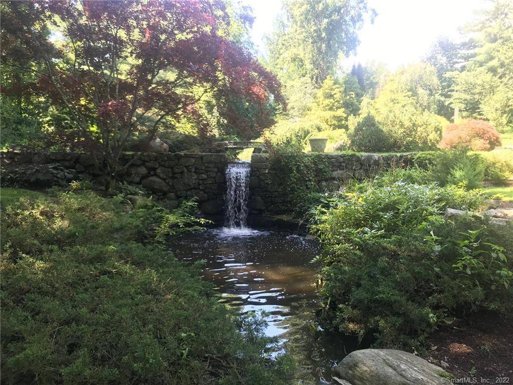 Venture through stone pillars, nestled at the end of a private lane sits this beautiful 4 bedroom colonial harmoniously sited on a breath taking, aw inspiring parkland w waterfall, koi ...