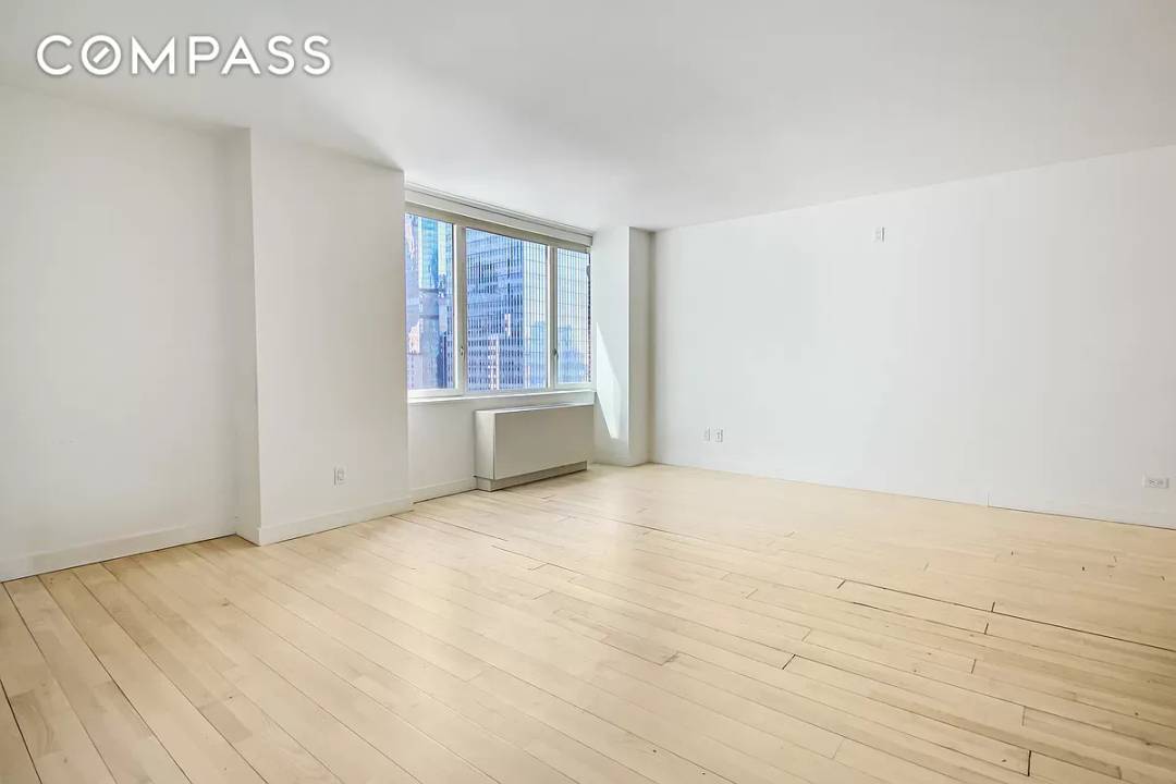 Massive high floor studio apartment at the renowned Sheffield Condominium.