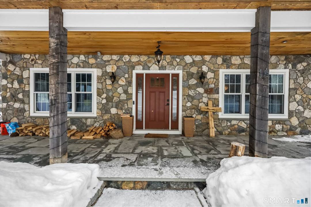 Nestled on 2. 06 acres of total privacy, this exceptional 2018 built home at 14 Laurelwood Drive offers the perfect blend of modern design, custom craftsmanship, and serene surroundings.