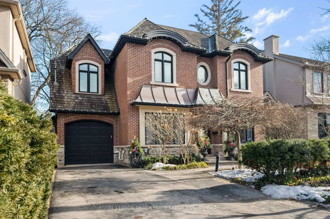 An Exceptional Family Home on One of The Kingsway's Most Coveted Streets !