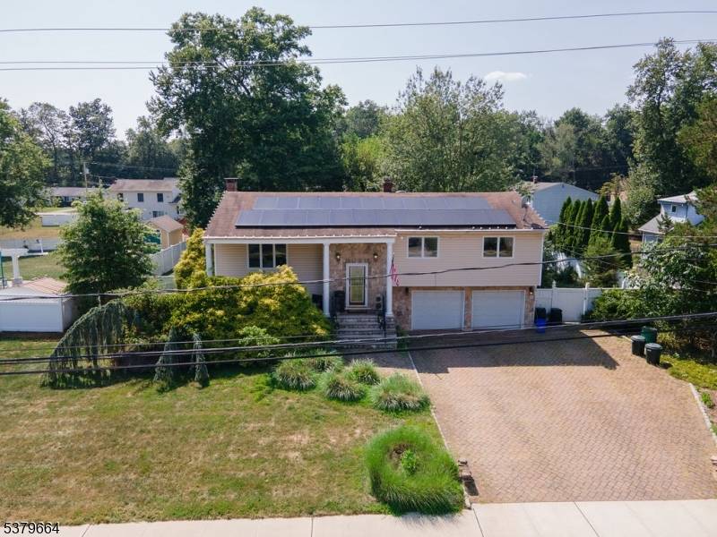 Welcome to this beautifully maintained bi level home set on a spacious 15, 000 sq ft lot.