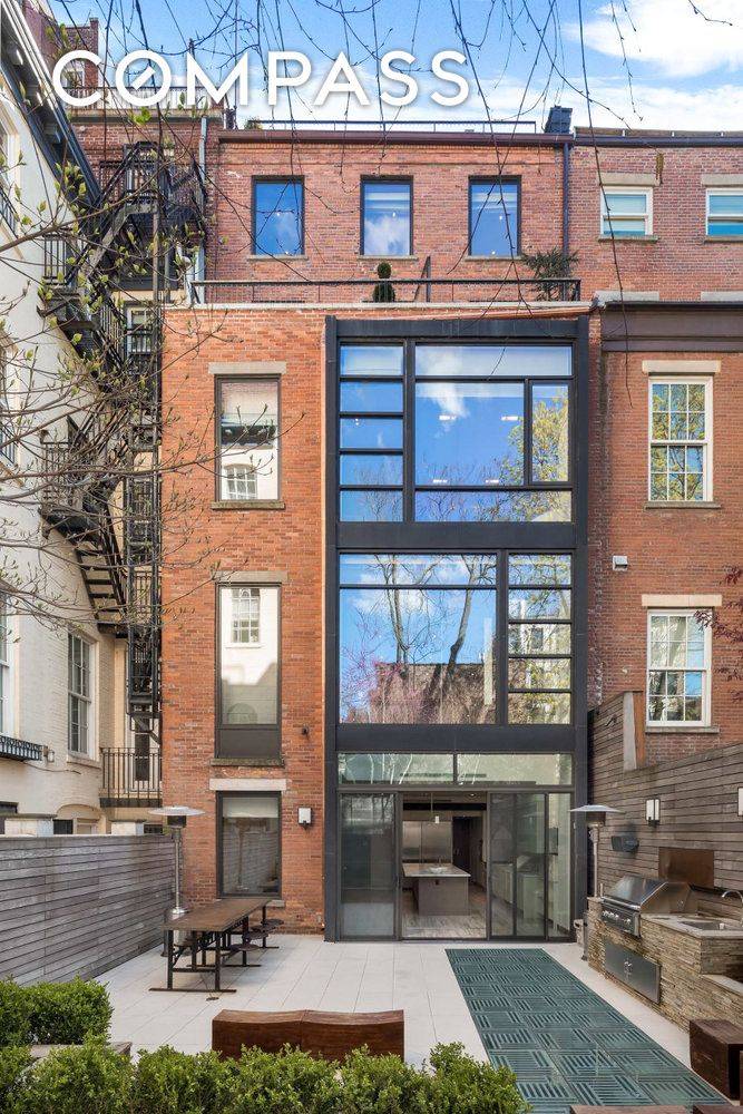 Privacy and perfection abound in this contemporary, 25 wide, Greek Revival townhouse.