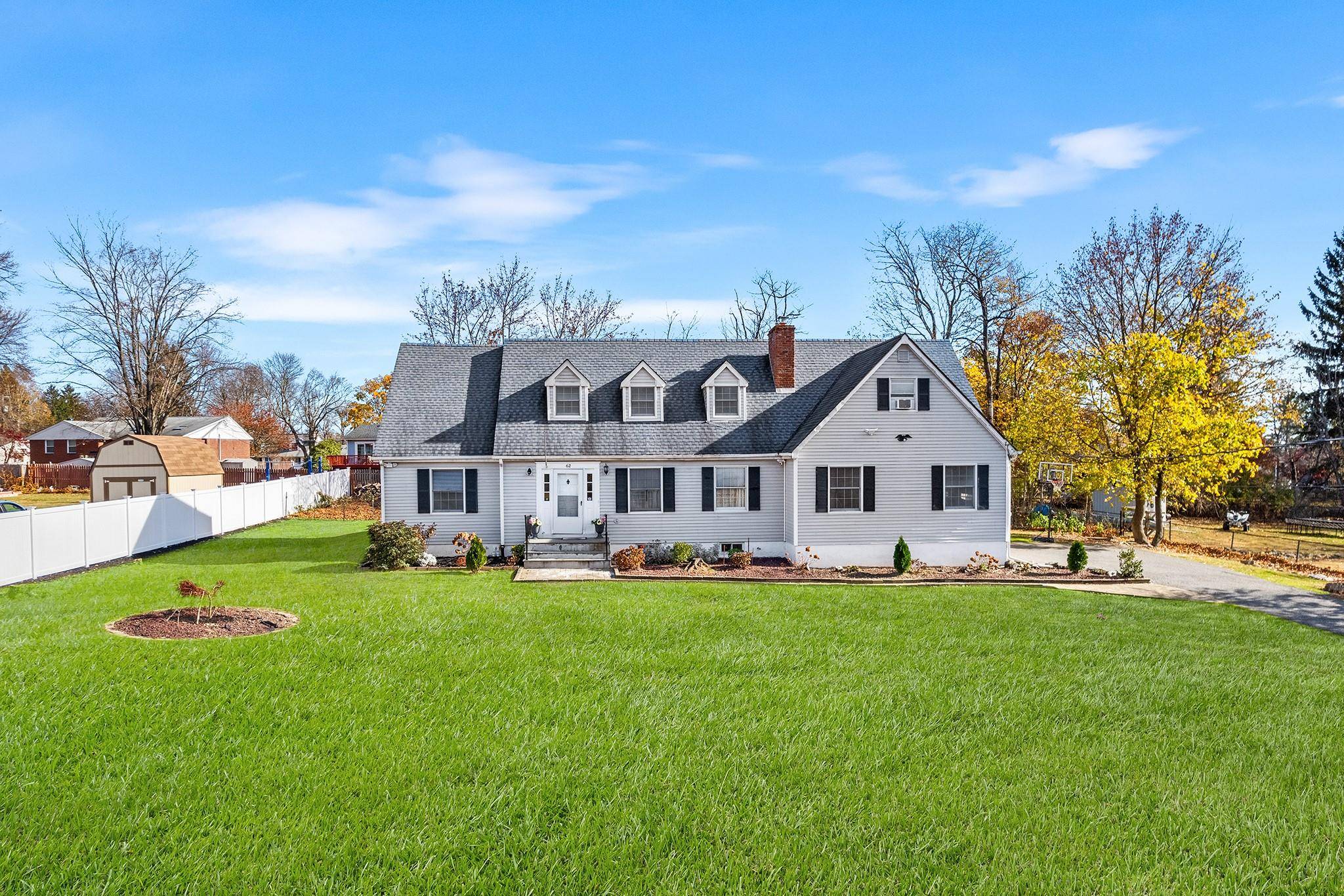 This charming contemporary Cape, nestled in the highly desirable Lake Casse Community, offers a beautifully landscaped, level lot with access to a spacious beach, playground, and clubhouse.