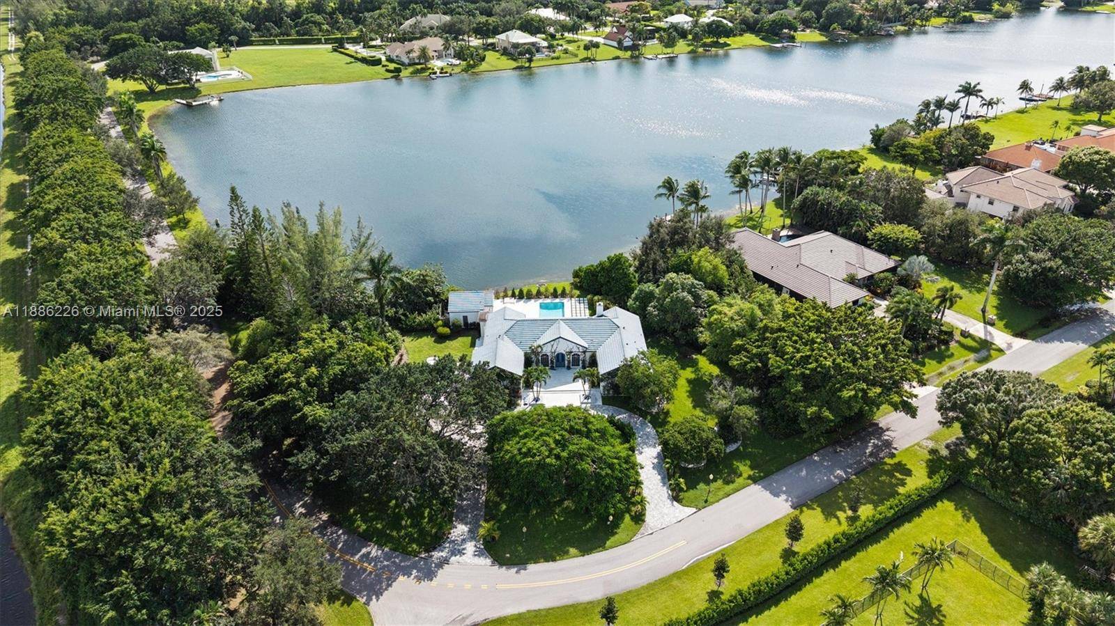 Beautifully updated home in the highly sought after boating and water ski community of Banyan Lakes.