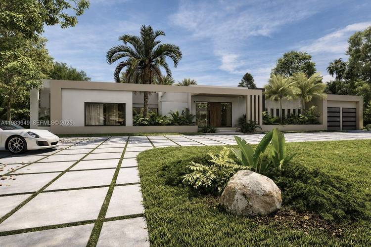 Striking brand new contemporary residence designed around a spectacular private courtyard pool with fountains and lush tropical landscaping, creating seamless indoor outdoor living.