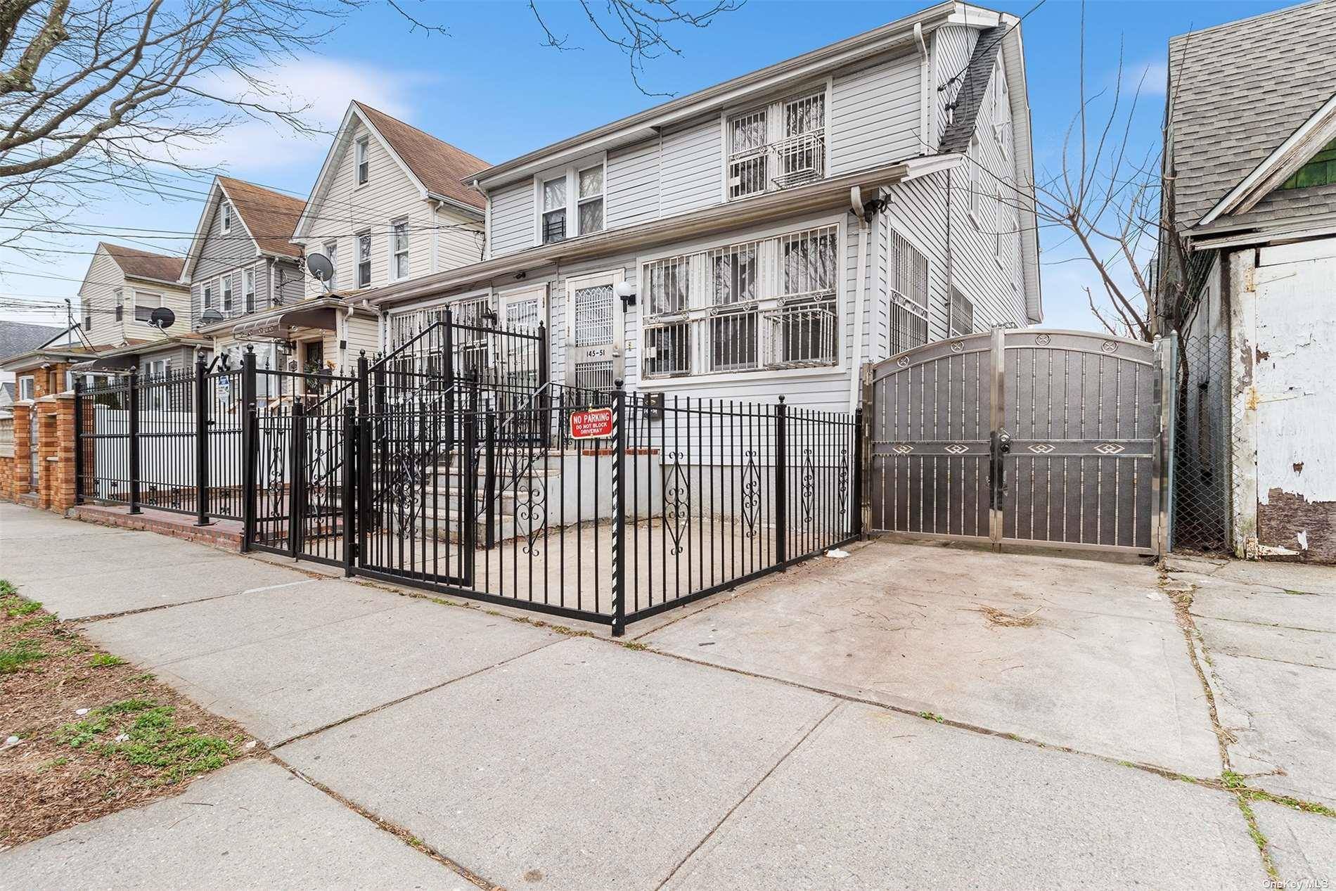 Discover the epitome of modern comfort in this charming two family semi detached home nestled in South Jamaica, boasting a sleek exterior with a private driveway and backyard oasis.