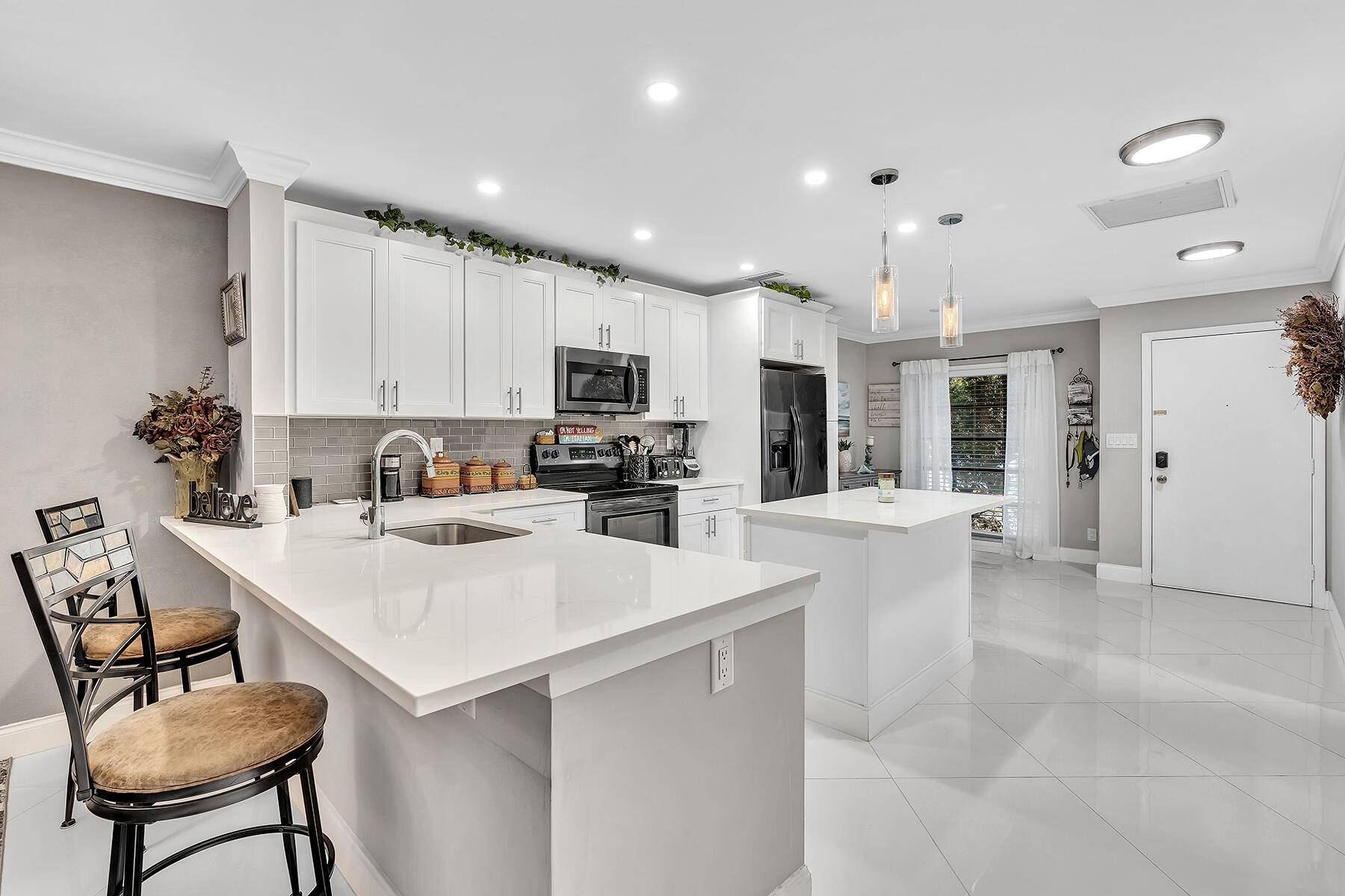 Step into this stunning 2 bedroom, 2 bathroom corner villa, completely remodeled for modern comfort and style.