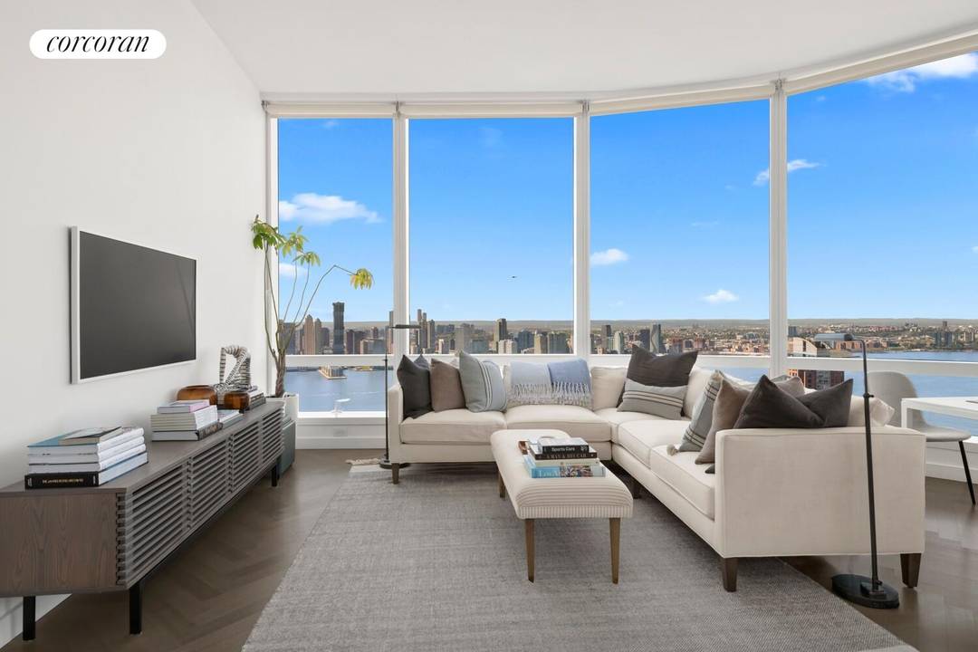 Perched on the 44th floor of 111 Murray Street, this extraordinary three bedroom, three and a half bathroom residence offers breathtaking panoramic views of the Hudson River and beyond, framed ...