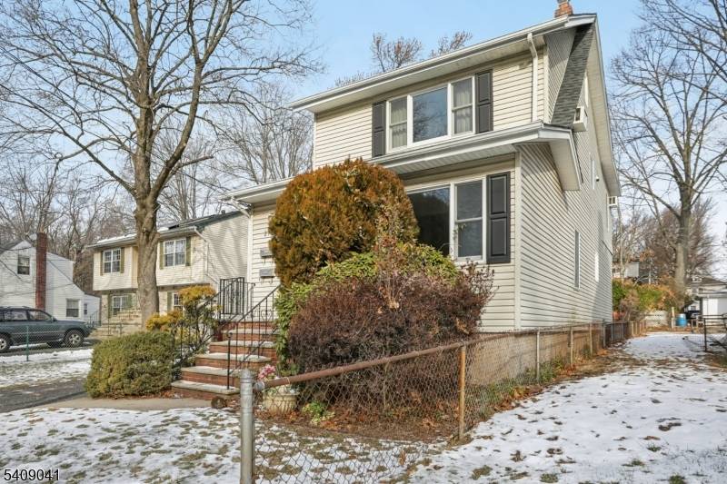 Welcome home to this 3 bedroom 2 bathroom Multifamily Colonial set on a wooded lot in the heart of Englewood.