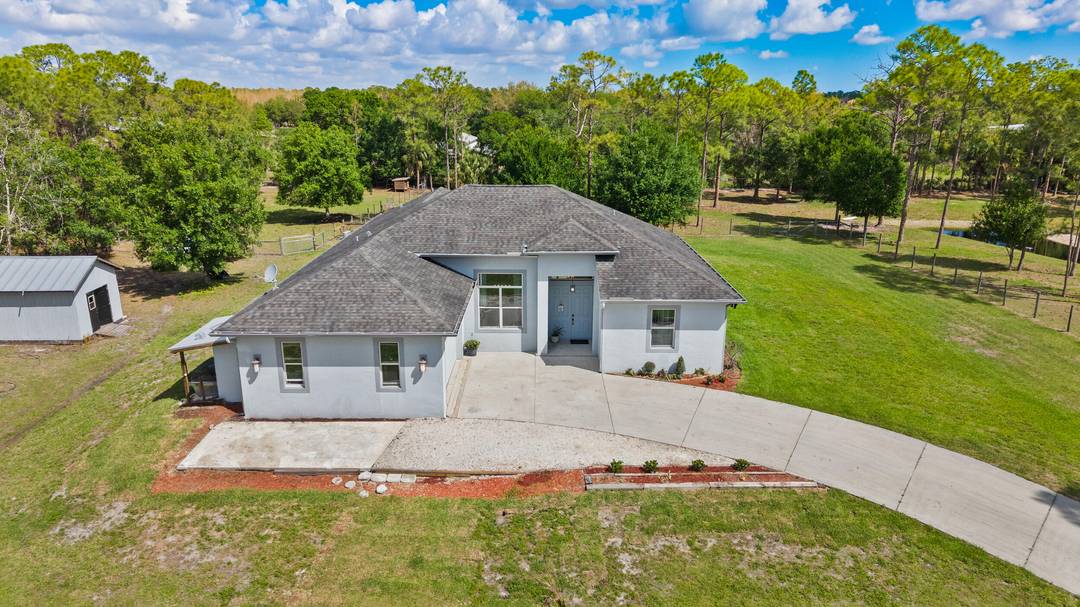 Private Palm City Farms retreat on 5 scenic acres with a natural preserve buffer, offering a rare blend of privacy, usable land, amp ; everyday comfort.