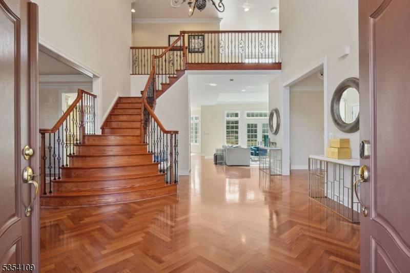 Welcome to 38 Lafayette Drive, a custom built Center Hall Colonial nestled in the prestigious Bel Air Woods neighborhood of Livingston.