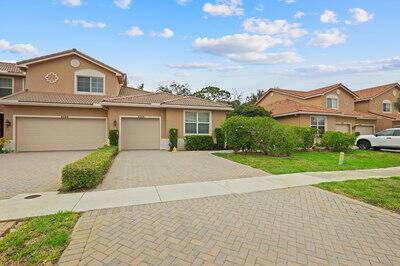 Welcome to this light filled and beautifully upgraded 2 bedroom, 2 bath end unit villa with 1 car garage, located in a quiet gated community and close to everything you ...