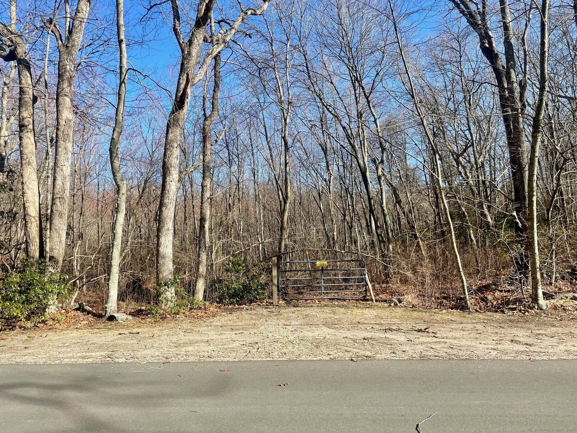 Nestled on 13. 27 acres of pristine raw land, this parcel boasts 617 feet of road frontage, making it easily accessible and highly visible.