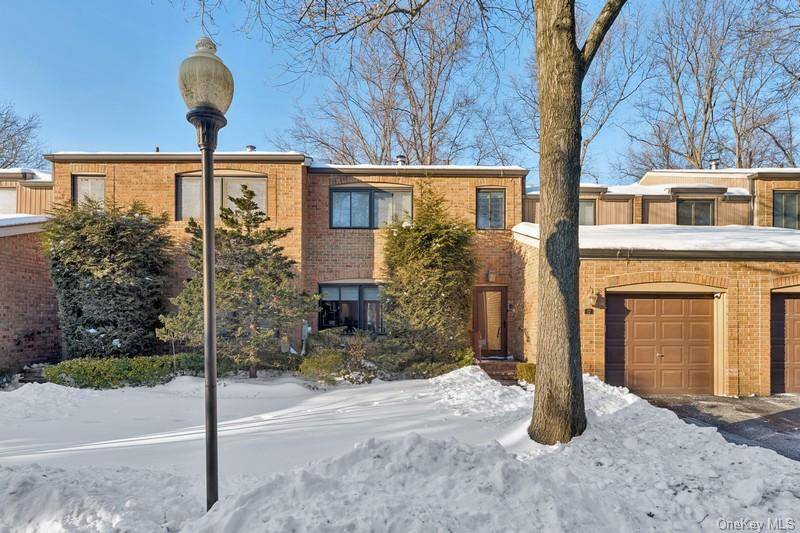 Welcome to 17 Windsor Gate Drive, a renovated townhouse condominium at the sought after Gates at North Hills.